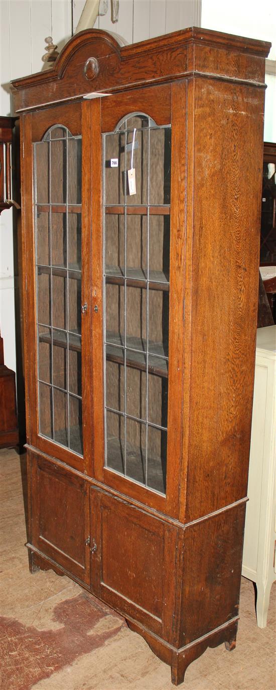 Oak bookcase, fitted glazed & panelled doors